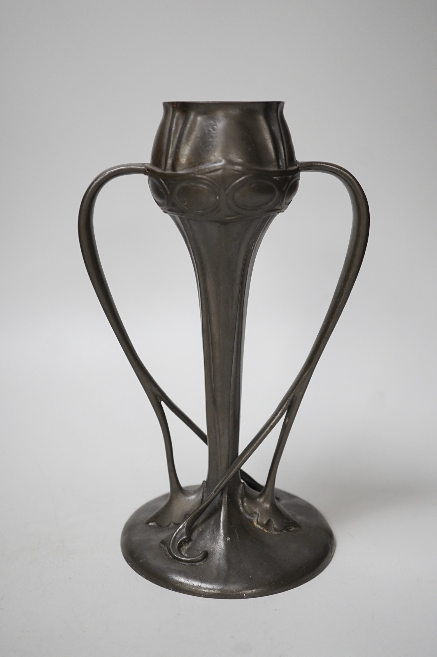 A Tudric pewter vase, model no. 029, 25cm tall